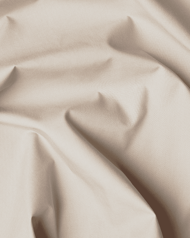 Close-up of the beige OEKO-TEX®-certified cotton used for the bed skirt